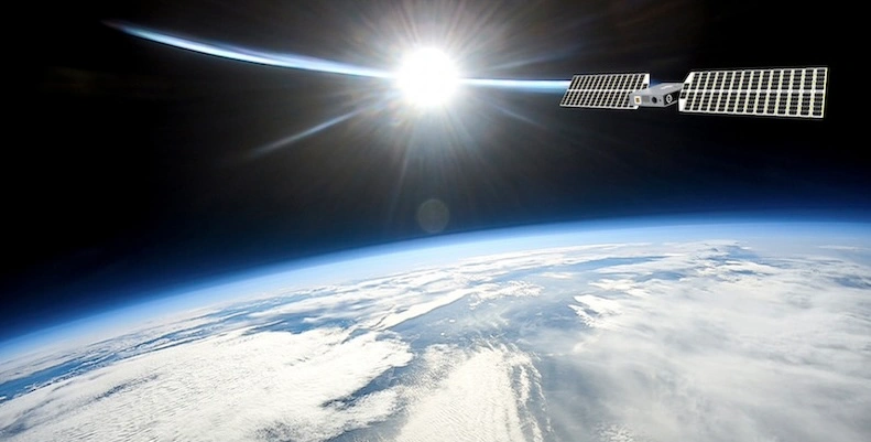 Xona satellite in orbit above Earth, with sunlight on the horizon